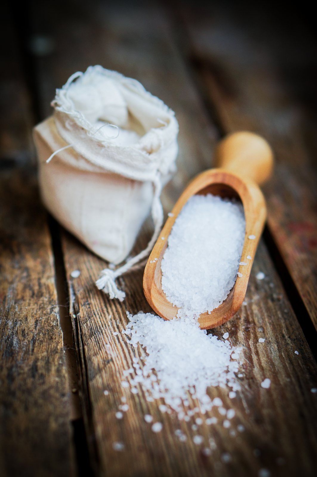 Closeup of sea salt on rustic wooden background